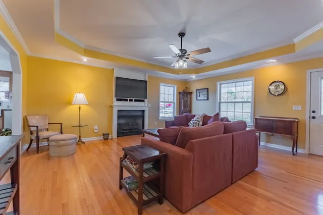 a living room with furniture and a fireplace