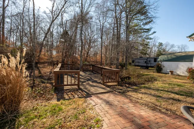 a view of a backyard with sitting area
