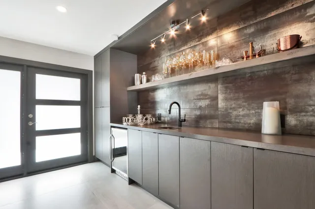 a kitchen with sink and cabinets