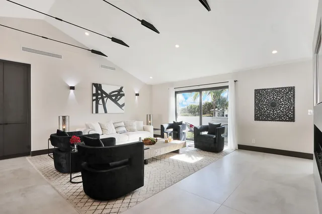 a kitchen with sink and large window