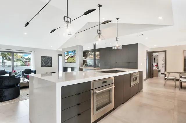 a bedroom with a bed and painting on the wall