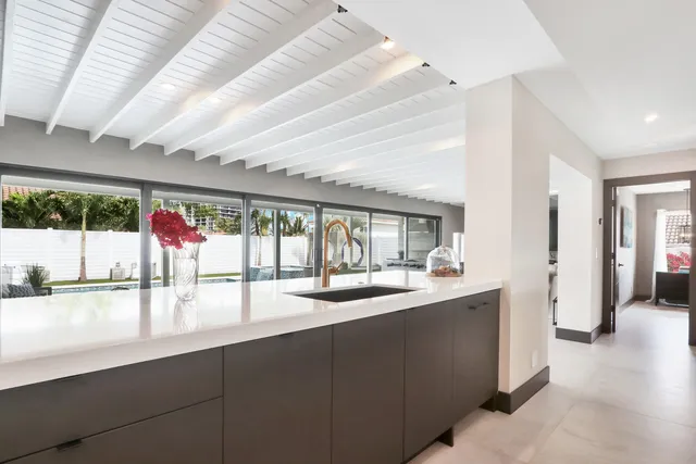 a bedroom with a bed and a chair