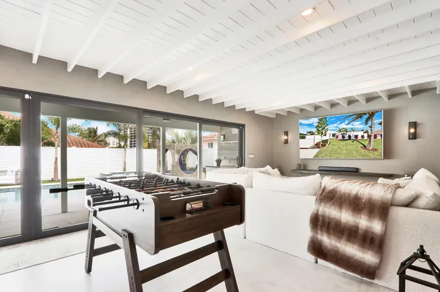 a bathroom with a sink vanity mirror and toilet
