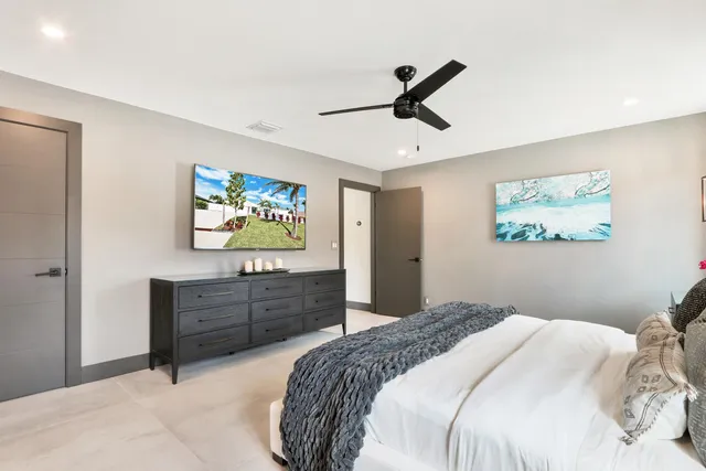 a view of a house with swimming pool and sitting area