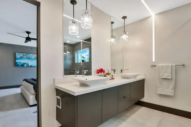 a view of a patio with a table and chairs under an umbrella