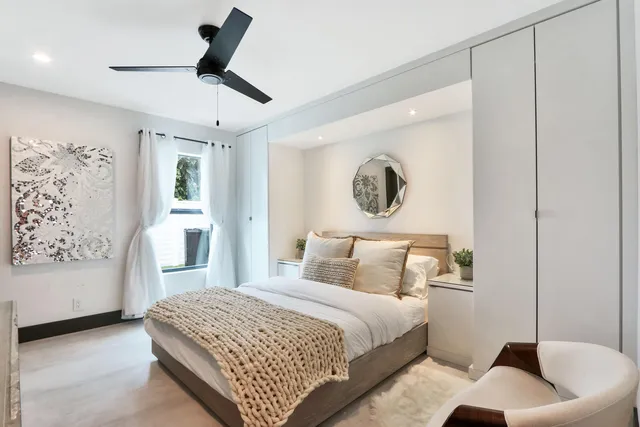 a patio with a table and chairs under an umbrella