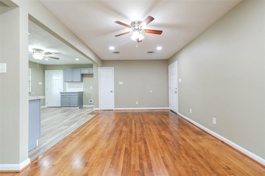 4139 Lumberdale Road Houston, TX 77092 - Photo 11 of 31 wooden floor in an empty room with a window