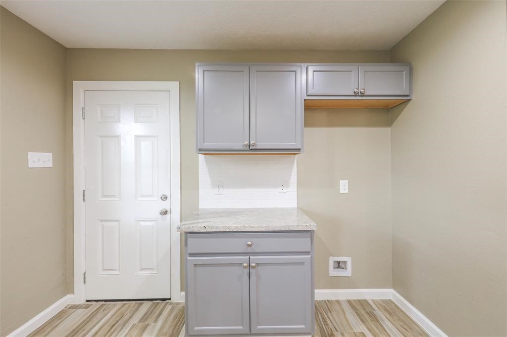 4139 Lumberdale Road Houston, TX 77092 - Photo 16 of 31 a view of walk in closet with wooden floor