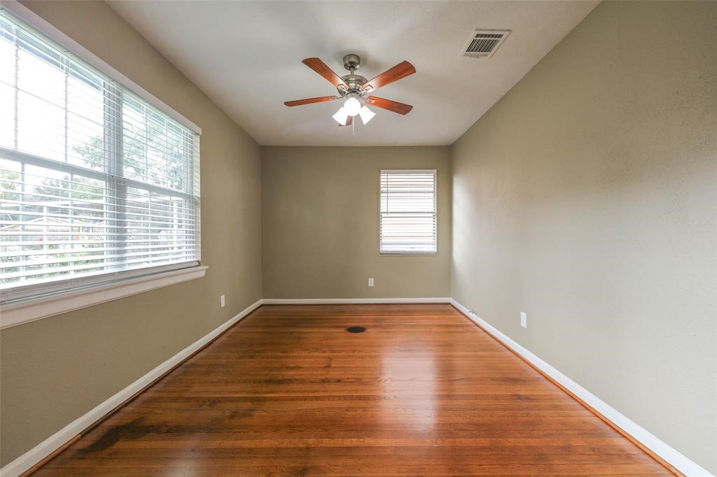 4139 Lumberdale Road Houston, TX 77092 - Photo 28 of 31 a view of an empty room with wooden floor and a window