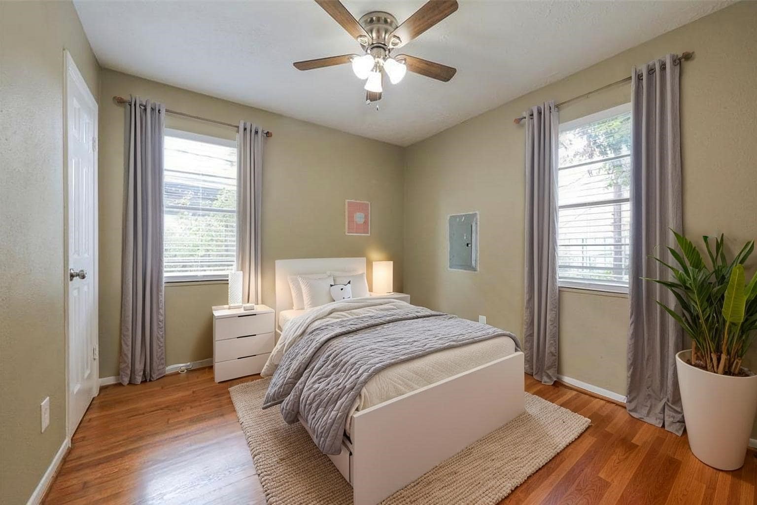 4139 Lumberdale Road Houston, TX 77092 - Photo 5 of 31 a bedroom with a bed and a potted plant