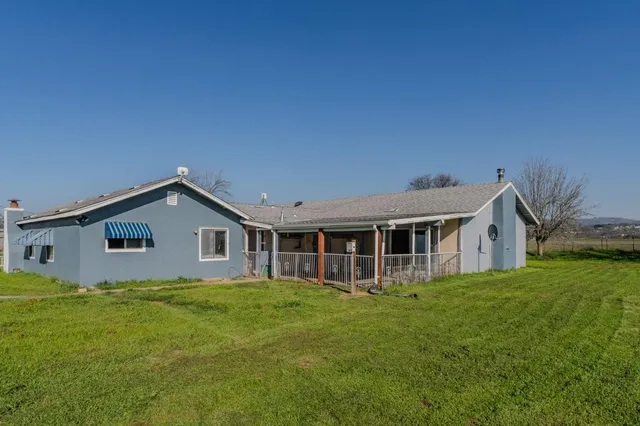 a kitchen with cabinets and a refrigerator