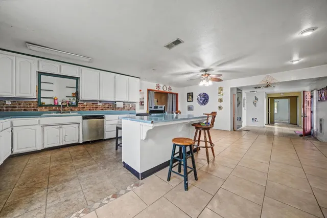 a living room with furniture and white walls