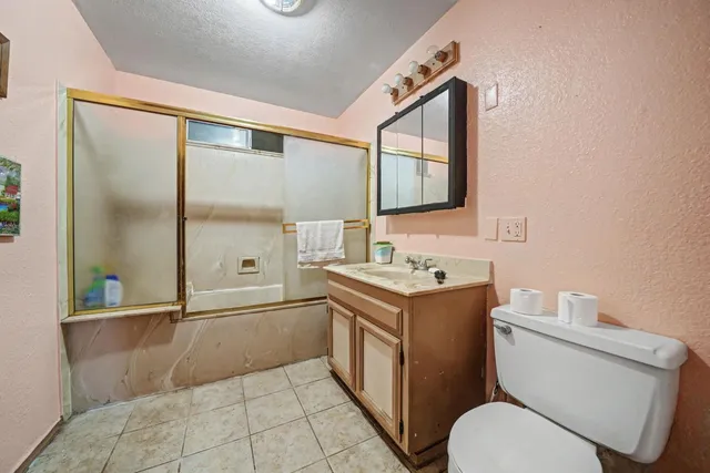 a bedroom with a bed and a desk