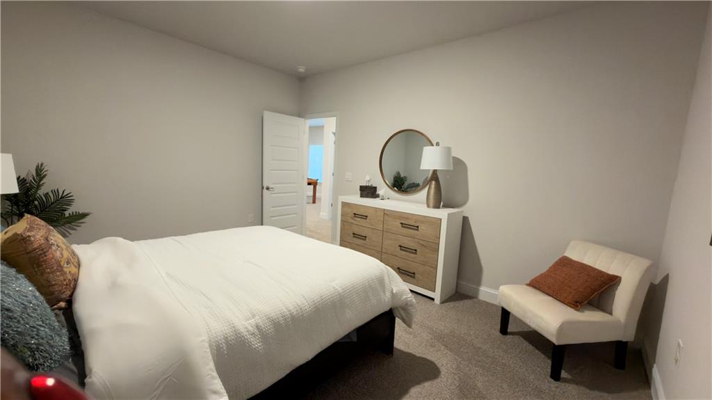 620 Bald Ridge Circle Demorest, GA 30535 - Photo 33 of 43 a bedroom with a bed and a chair