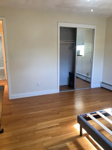 a view of room with wooden floor