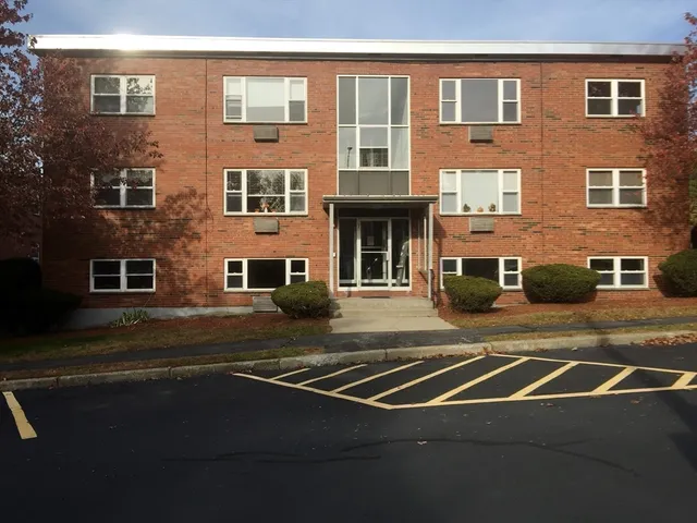 a view of a building with a street