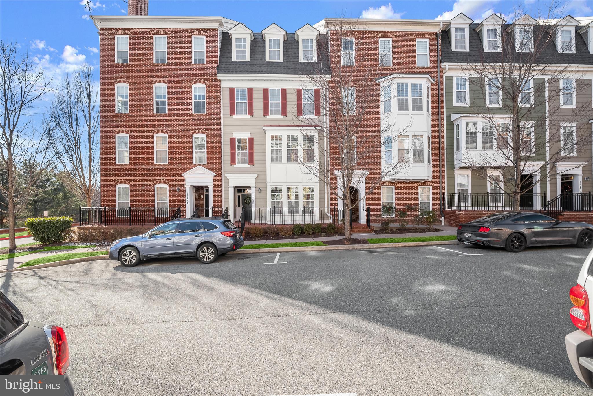 11246-1 Chase Street, Unit 141 Fulton, MD 20759 - Photo 1 of 38 a view of a street that has couple of cars parked on the road