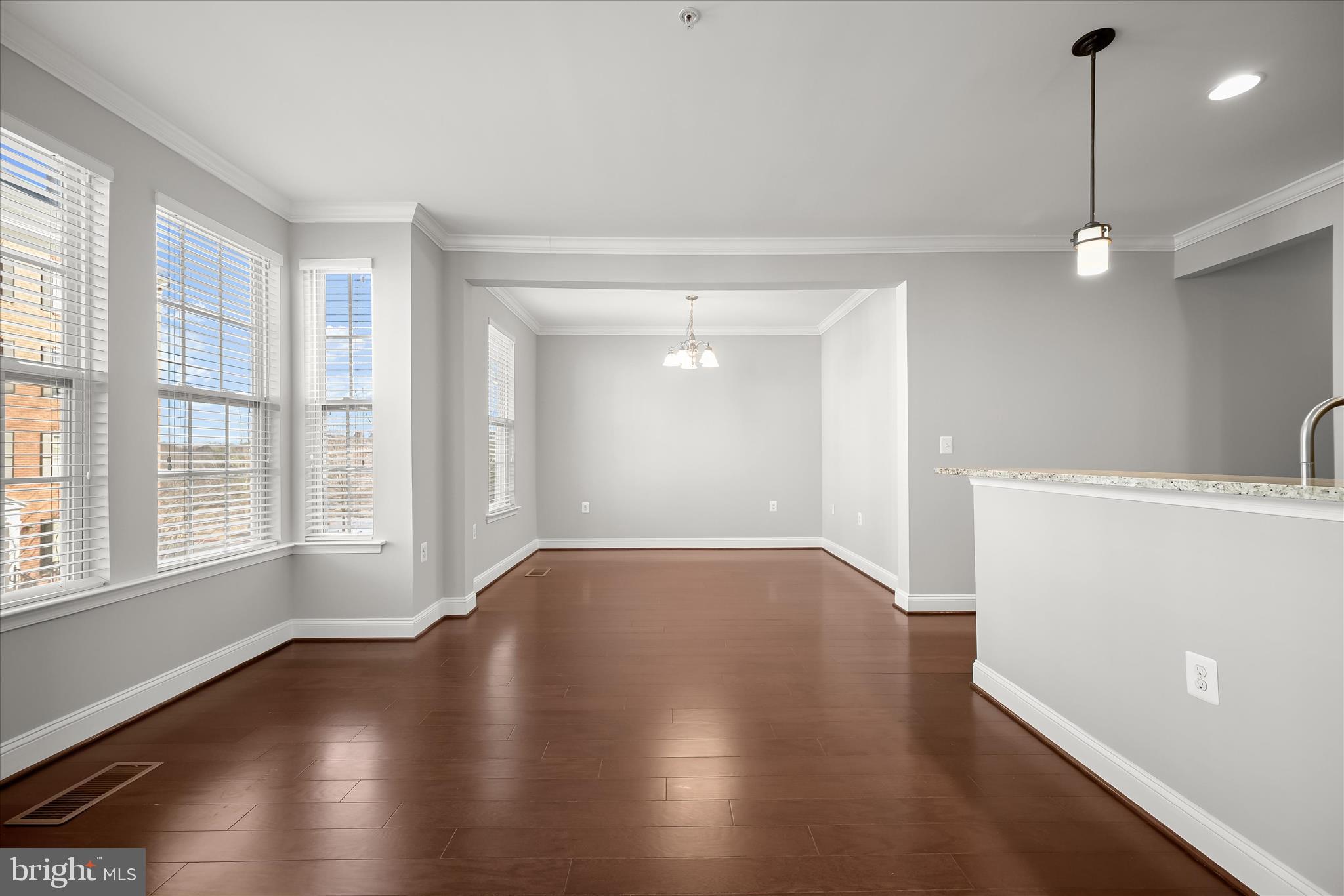 11246-1 Chase Street, Unit 141 Fulton, MD 20759 - Photo 20 of 38 a view of an empty room with wooden floor and a window