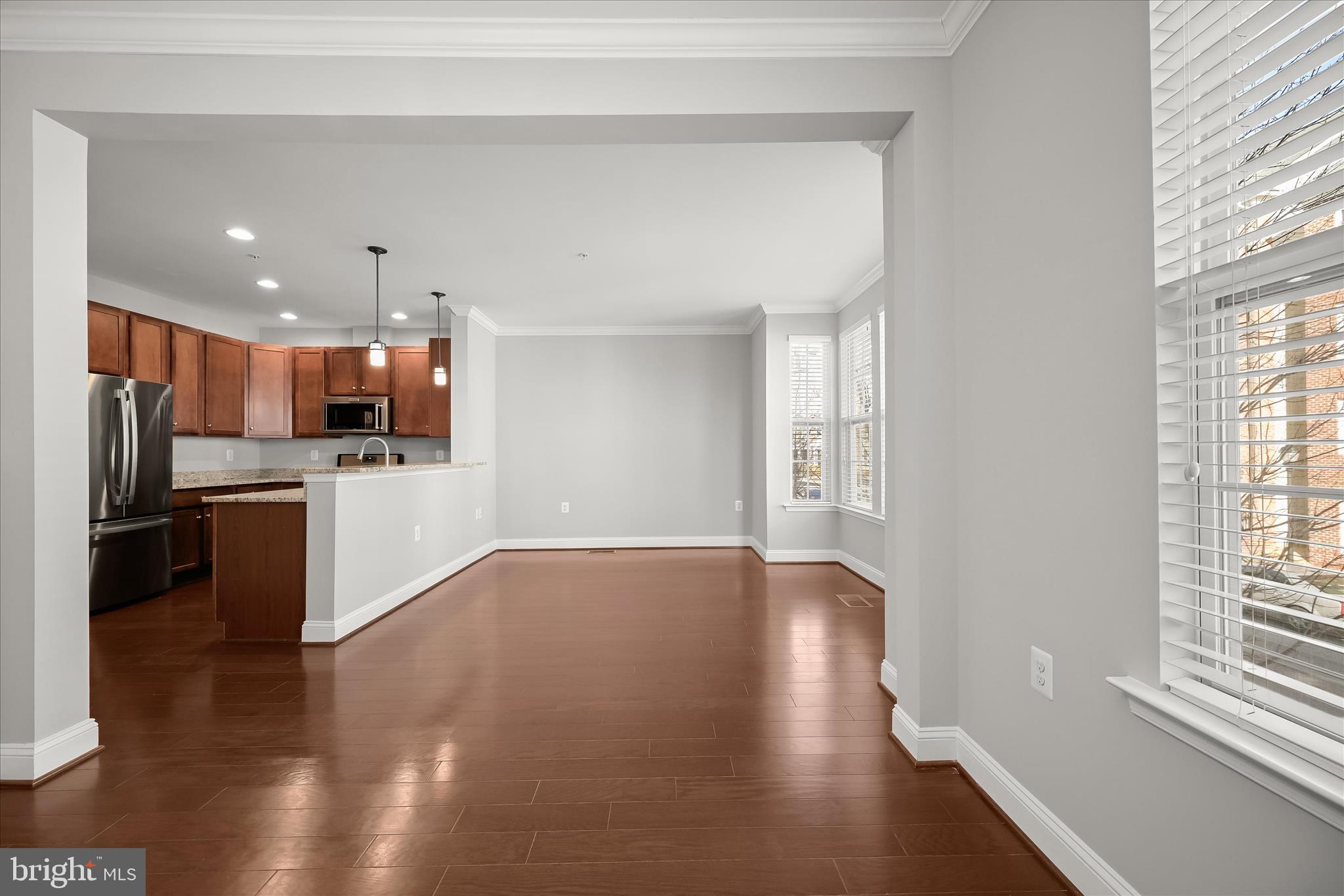 11246-1 Chase Street, Unit 141 Fulton, MD 20759 - Photo 25 of 38 a view of kitchen with wooden floor and electronic appliances