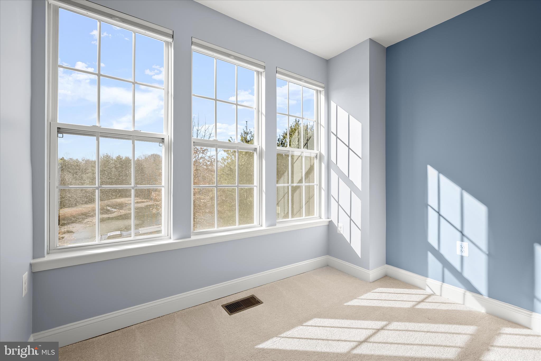 11246-1 Chase Street, Unit 141 Fulton, MD 20759 - Photo 28 of 38 a view of an empty room with a window