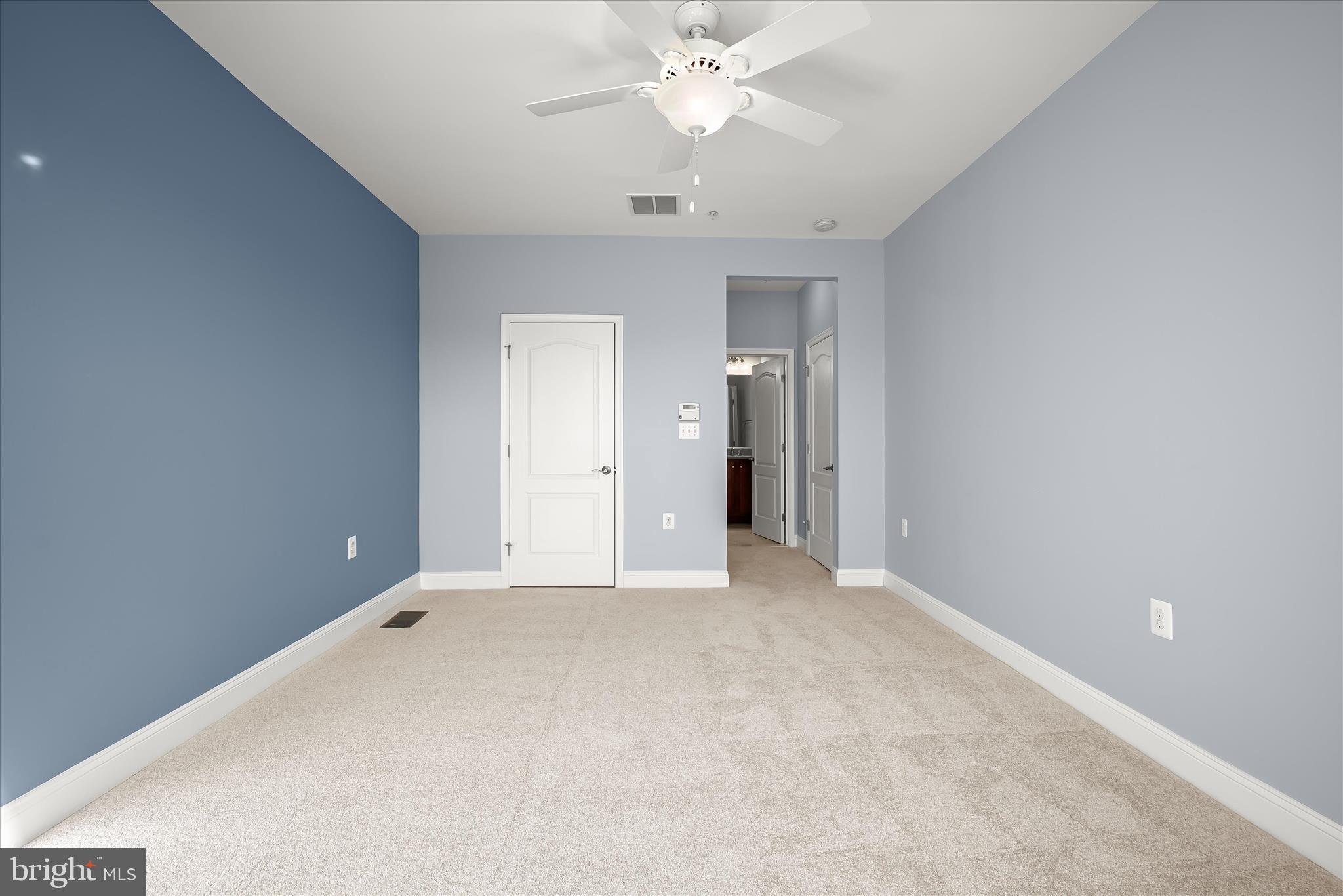 11246-1 Chase Street, Unit 141 Fulton, MD 20759 - Photo 29 of 38 a view of an empty room with a ceiling fan