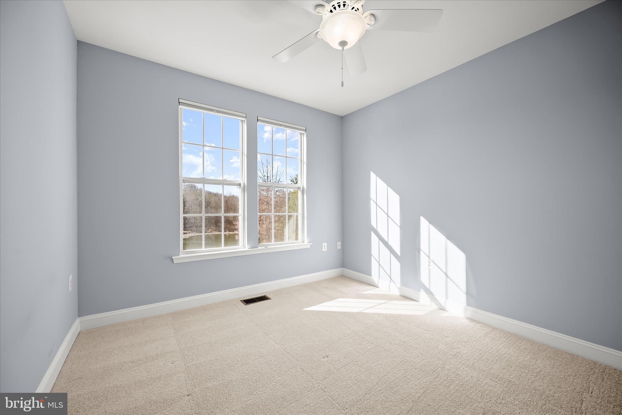 11246-1 Chase Street, Unit 141 Fulton, MD 20759 - Photo 35 of 38 a view of an empty room with a window