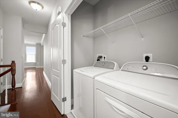 a view of storage and utility room with racks on the wall