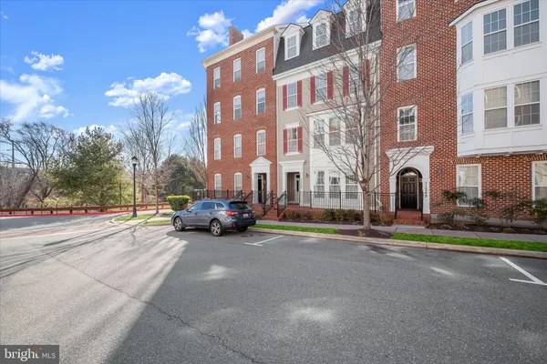 a view of a parked cars in front of a building