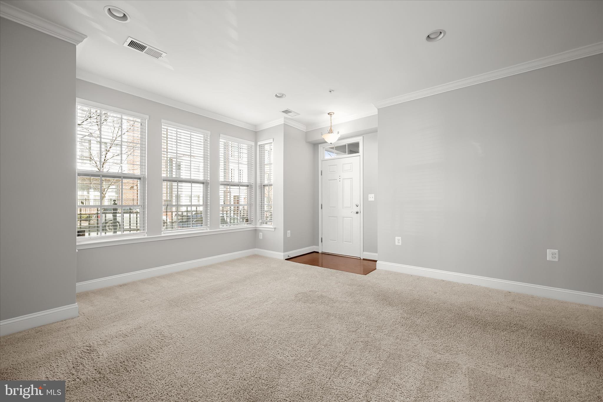 11246-1 Chase Street, Unit 141 Fulton, MD 20759 - Photo 4 of 38 a view of an empty room with a window