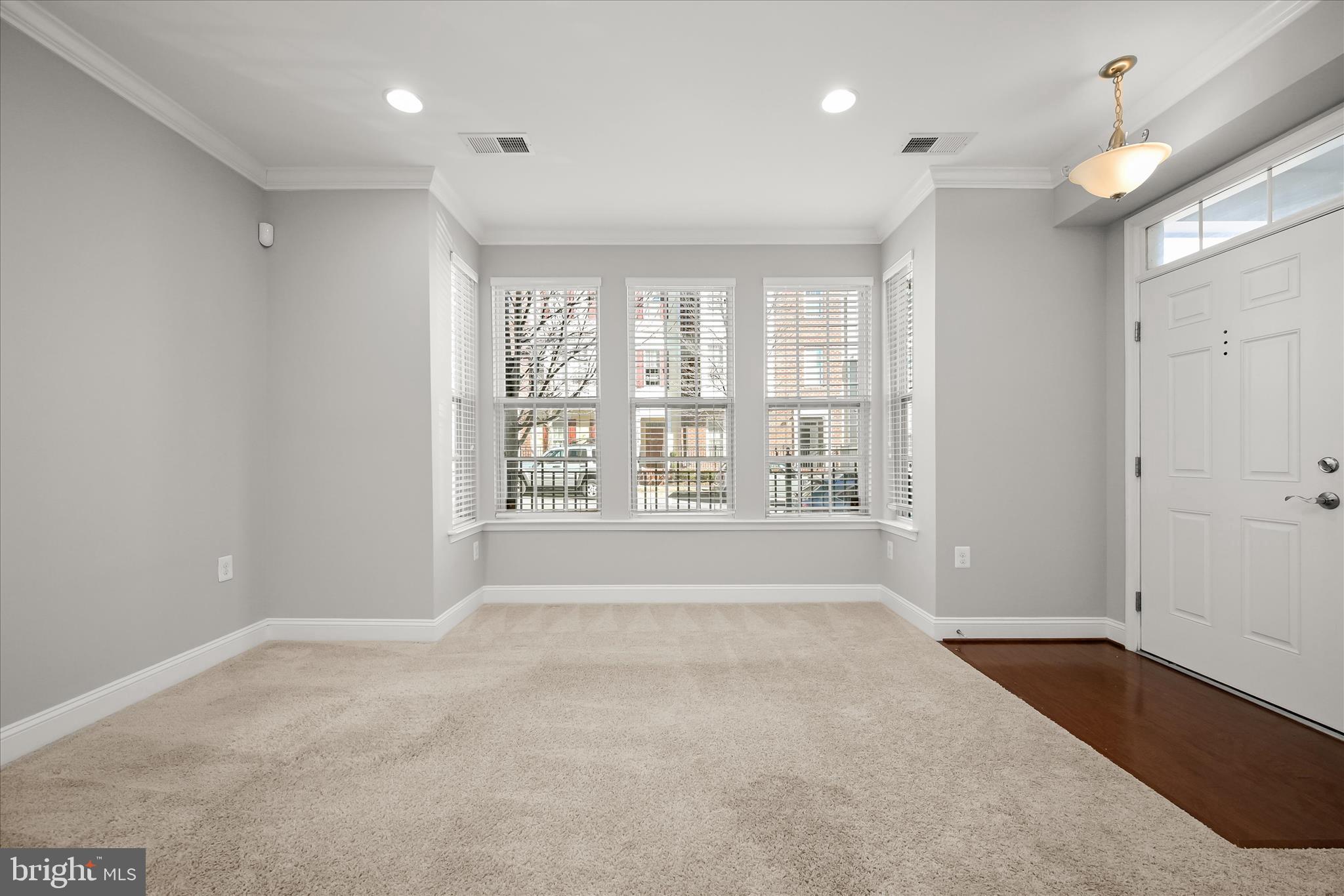 11246-1 Chase Street, Unit 141 Fulton, MD 20759 - Photo 5 of 38 a view of an empty room with a window
