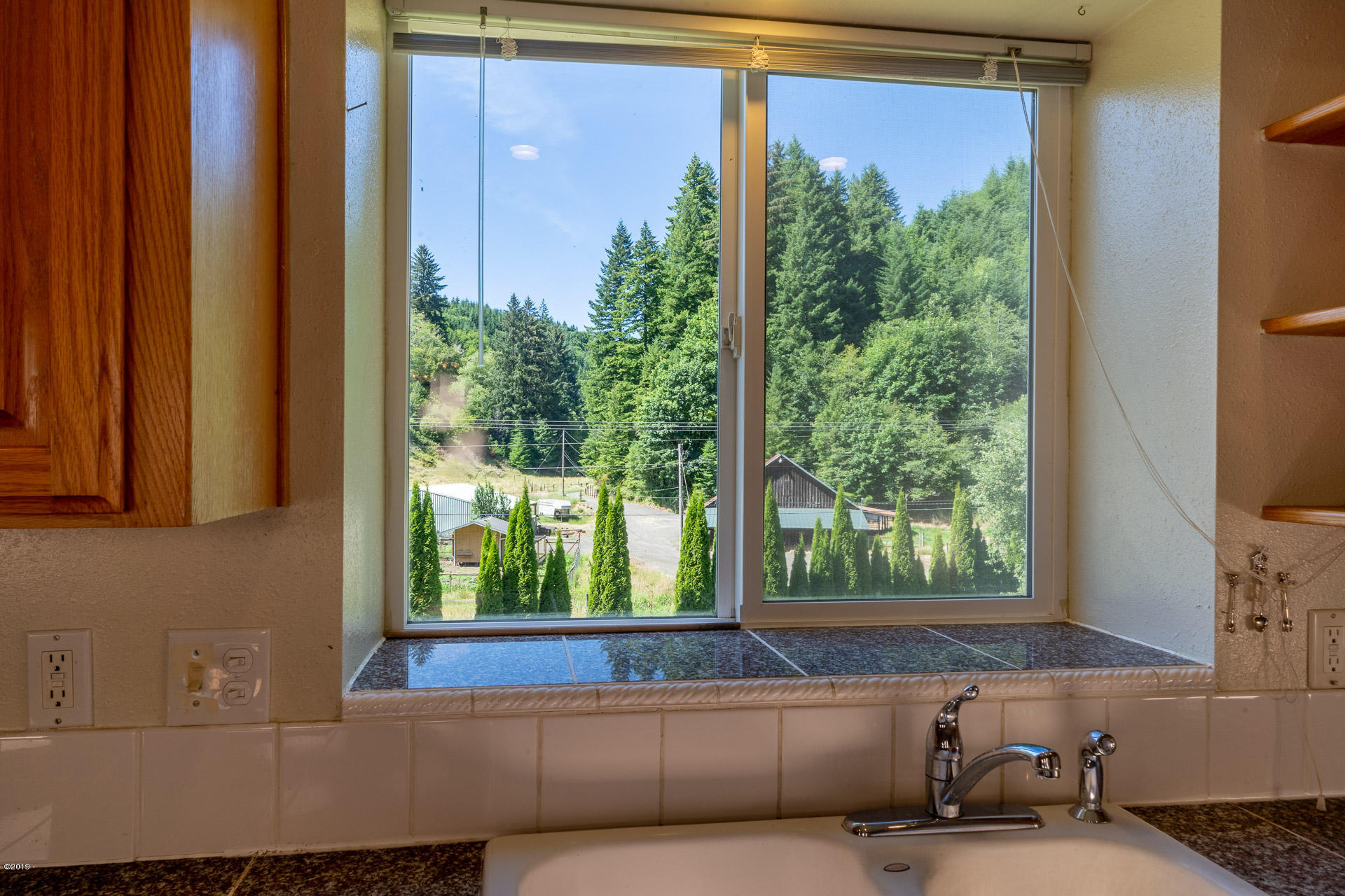 429 Hidden Valley Road Toledo, OR 97391 - Photo 12 of 41 VIEW FROM KITCHEN SINK