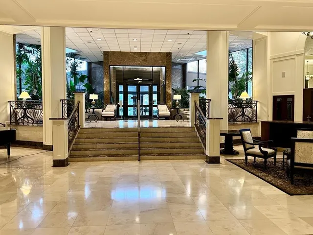 a view of a livingroom with furniture and a flat screen tv