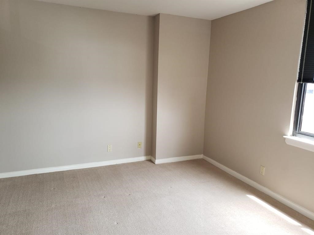 3525 Sage Road, Unit 704 Houston, TX 77056 - Photo 19 of 29 an empty room with windows