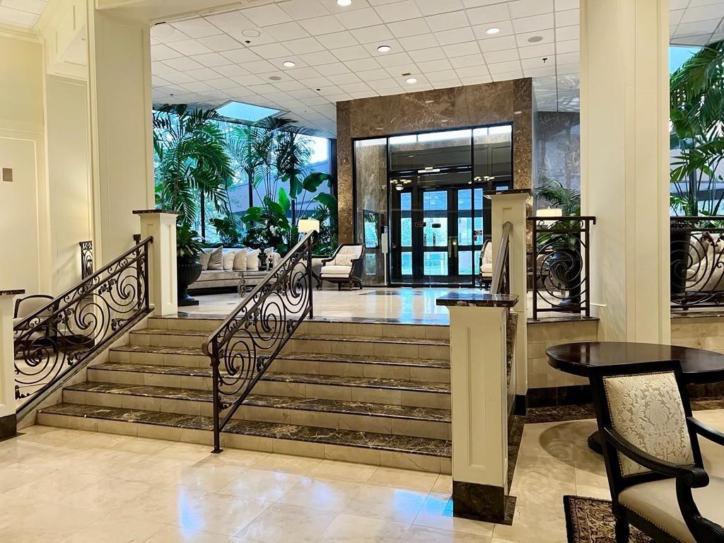 3525 Sage Road, Unit 704 Houston, TX 77056 - Photo 2 of 29 a view of entryway livingroom and hall with wooden floor