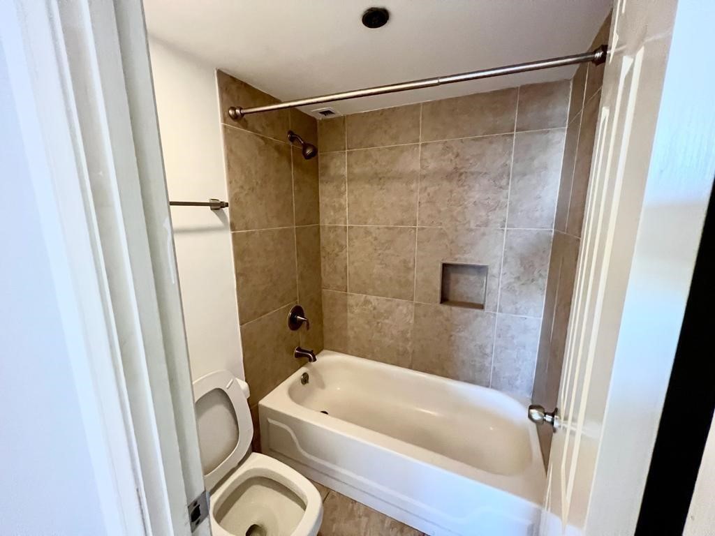 3525 Sage Road, Unit 704 Houston, TX 77056 - Photo 24 of 29 a bathroom with a tub a sink and a shower
