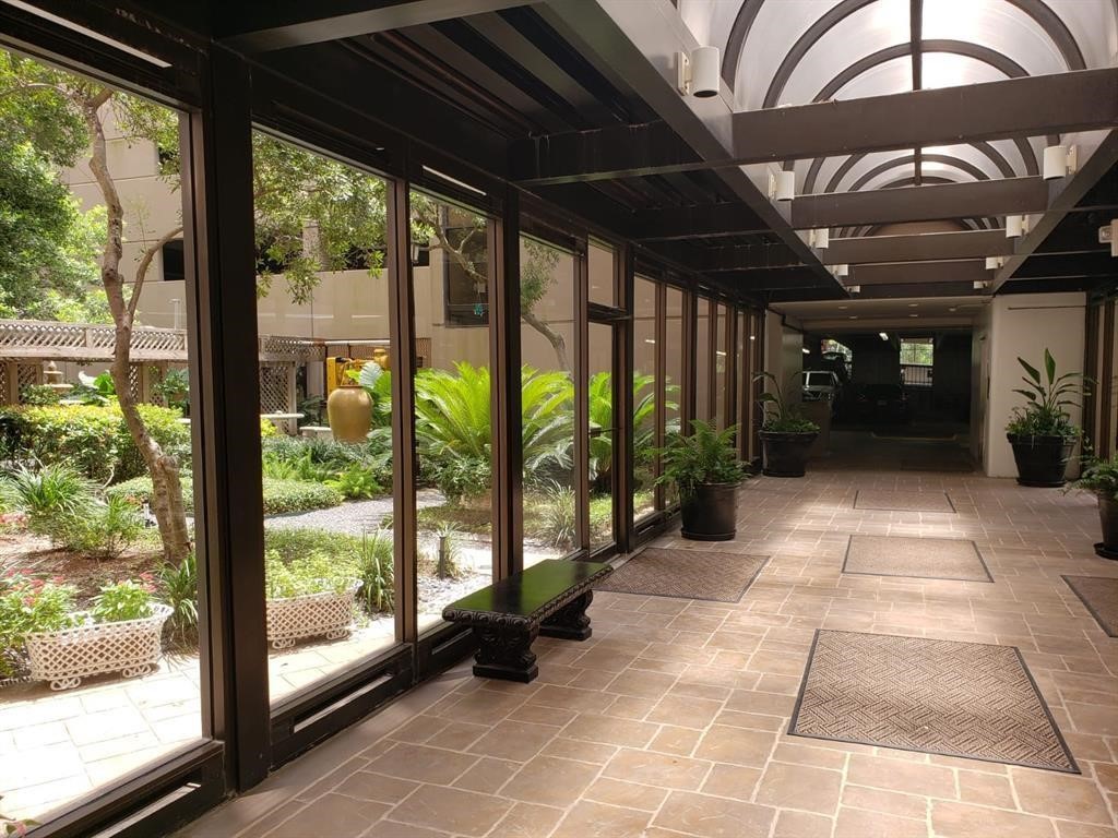 3525 Sage Road, Unit 704 Houston, TX 77056 - Photo 5 of 29 a view of a porch with a wooden floor