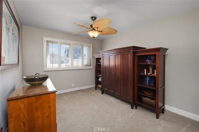 a bathroom with a granite countertop sink mirror vanity bathtub and a toilet