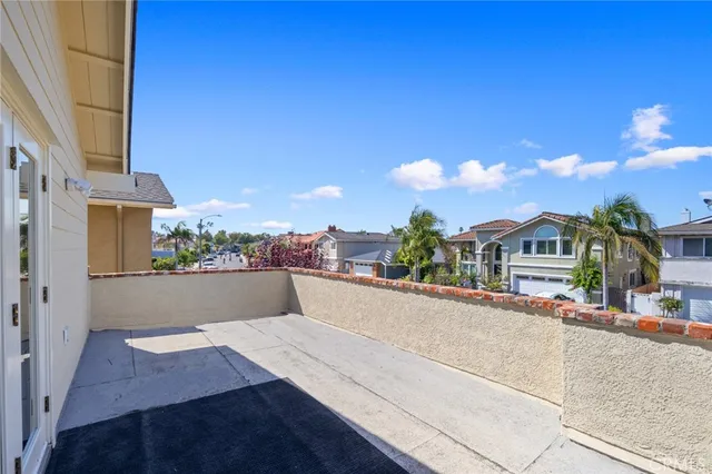 a spacious bedroom with a bed and a chandelier