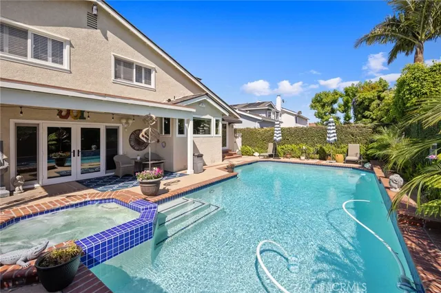a front view of house with yard patio and outdoor seating