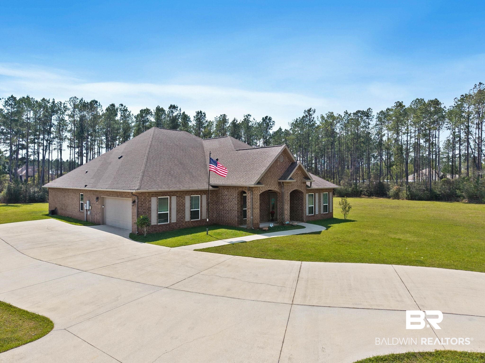 12750 B Jenkins Pit Road Daphne, AL 36527 - Photo 78 of 89 View of front of house featuring a front yard, a shingled roof, brick siding, and an attached garage