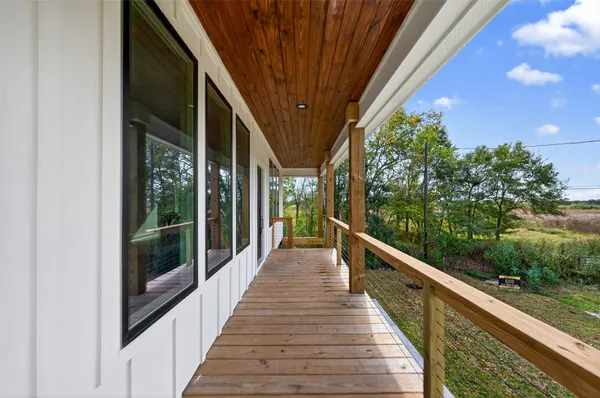 a view of balcony and yard