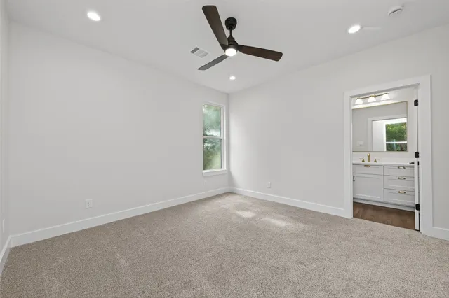 an aerial view of residential houses with outdoor space and swimming pool