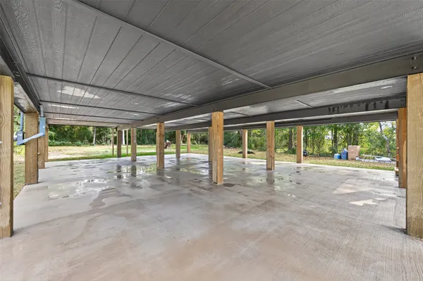a view of an empty room with a large window