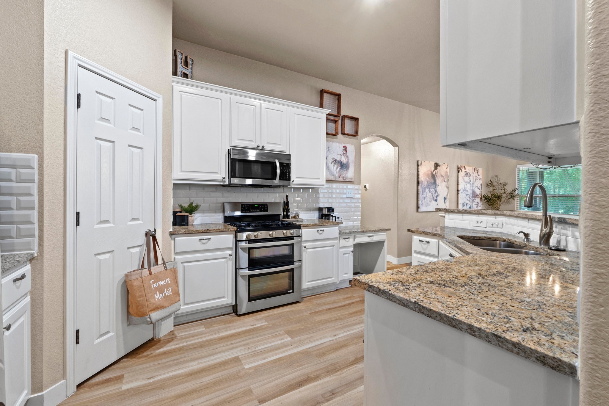 1020 Portchester Castle Path Pflugerville, TX 78660 - Photo 14 of 29 A look at the pantry and abundant cabinet and countertop space, ensuring plenty of room for all of your kitchen needs.