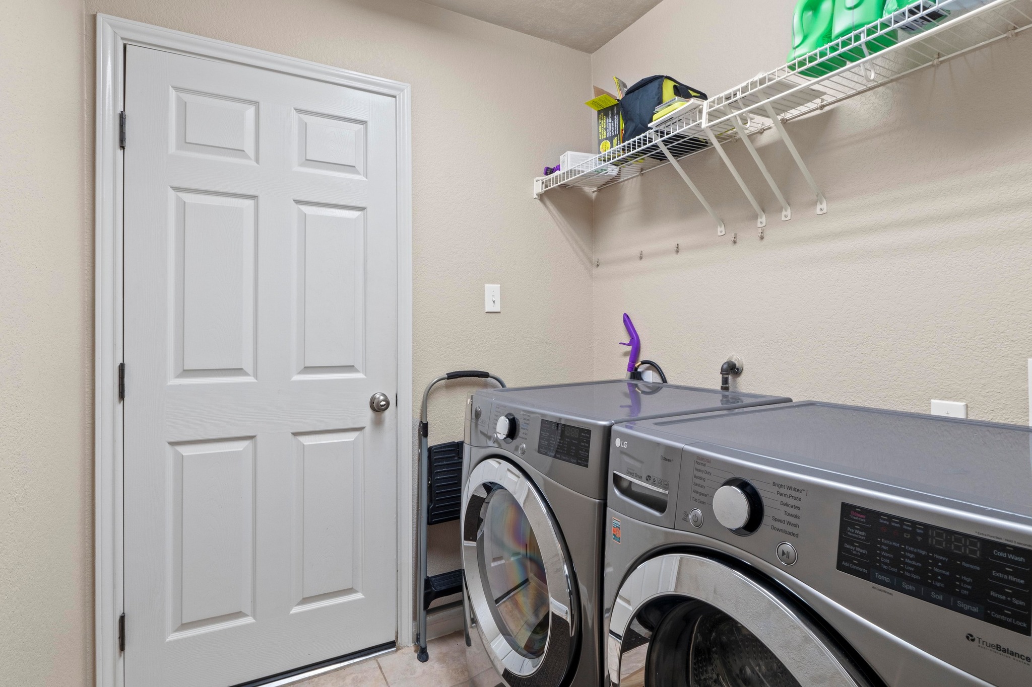 1020 Portchester Castle Path Pflugerville, TX 78660 - Photo 24 of 29 The laundry room is complete with W/D connections and overhead shelf space for your laundry needs.