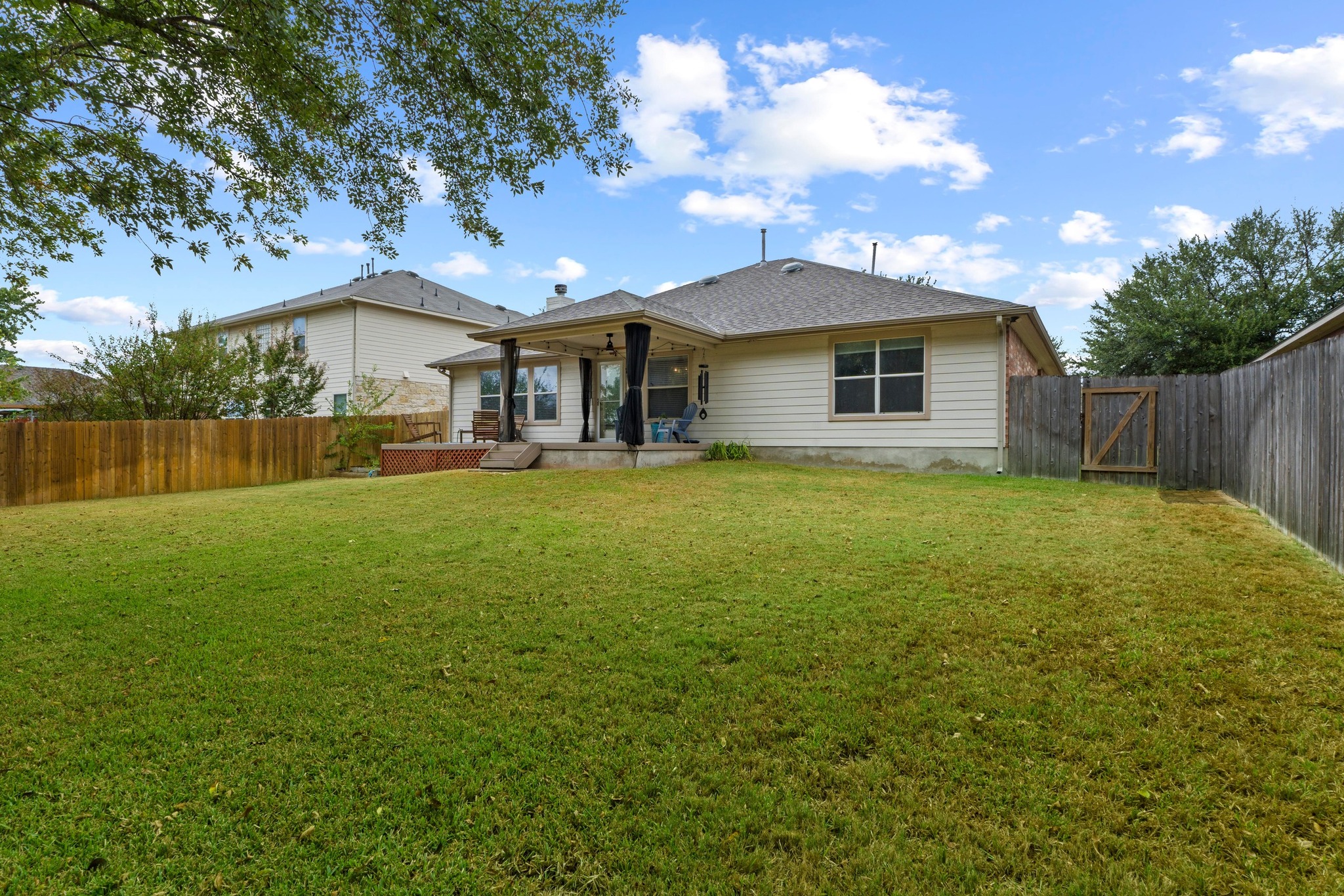 1020 Portchester Castle Path Pflugerville, TX 78660 - Photo 28 of 29 The expansive backyard provides space for outdoor fun, entertaining, or simply sitting out and soaking up some sun.