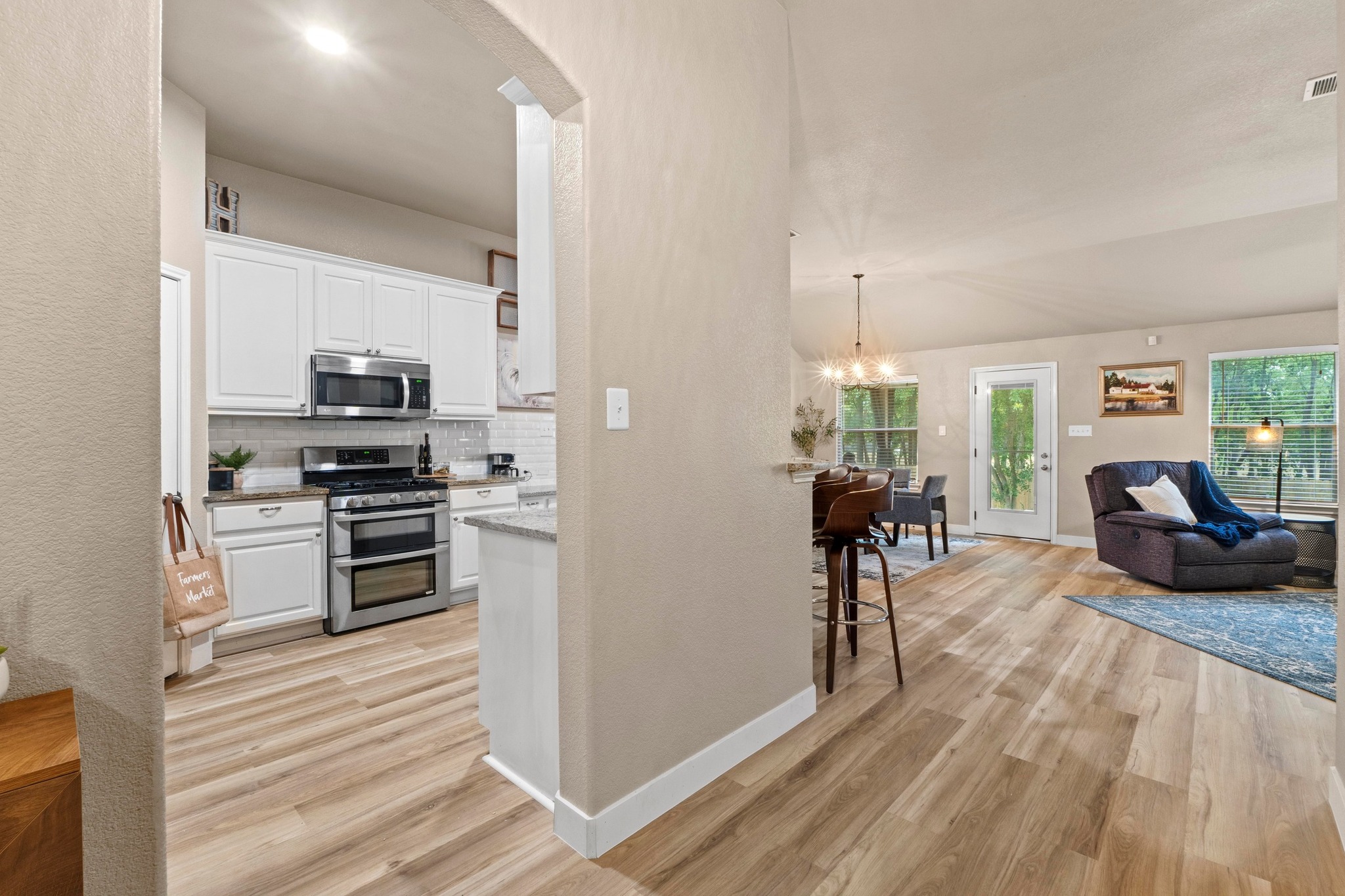 1020 Portchester Castle Path Pflugerville, TX 78660 - Photo 10 of 29 This angle showcases the open layout, seamlessly connecting each space, making maneuvering around the home a breeze.