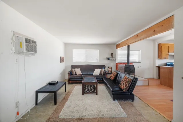 a living room with furniture and a rug