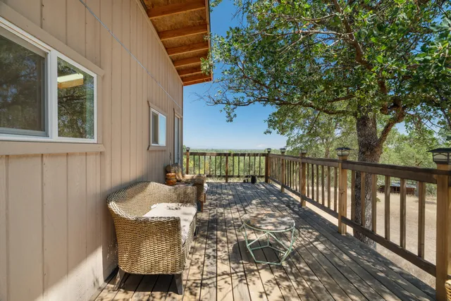 a view of balcony with furniture