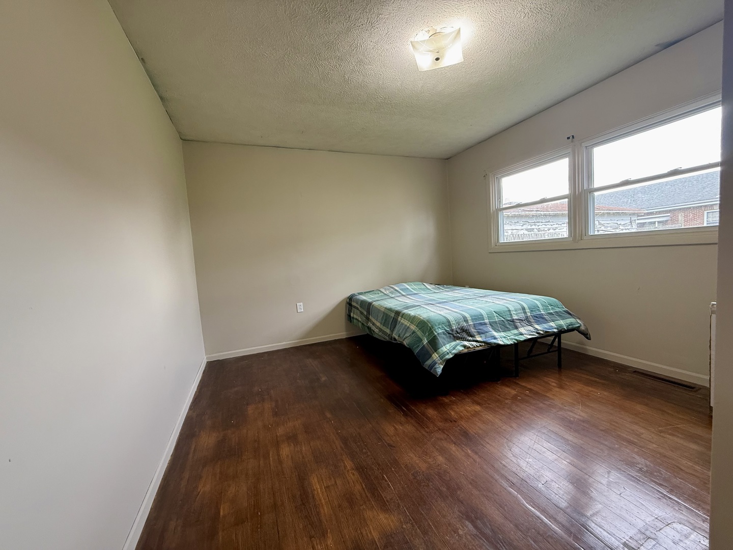 1305 Harper Drive Rantoul, IL 61866 - Photo 9 of 10 a bedroom with a bed and a window